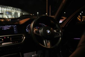 The interior of a car at night with a dashboard — illustrative photography