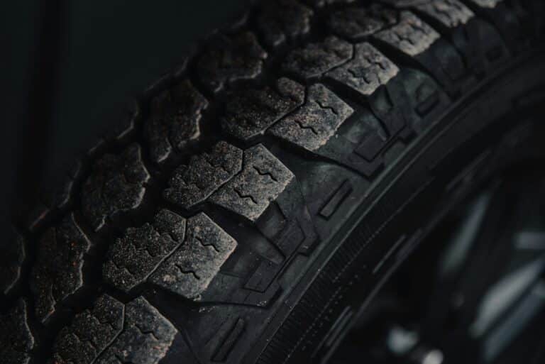 Black tire on black surface — illustrative photography