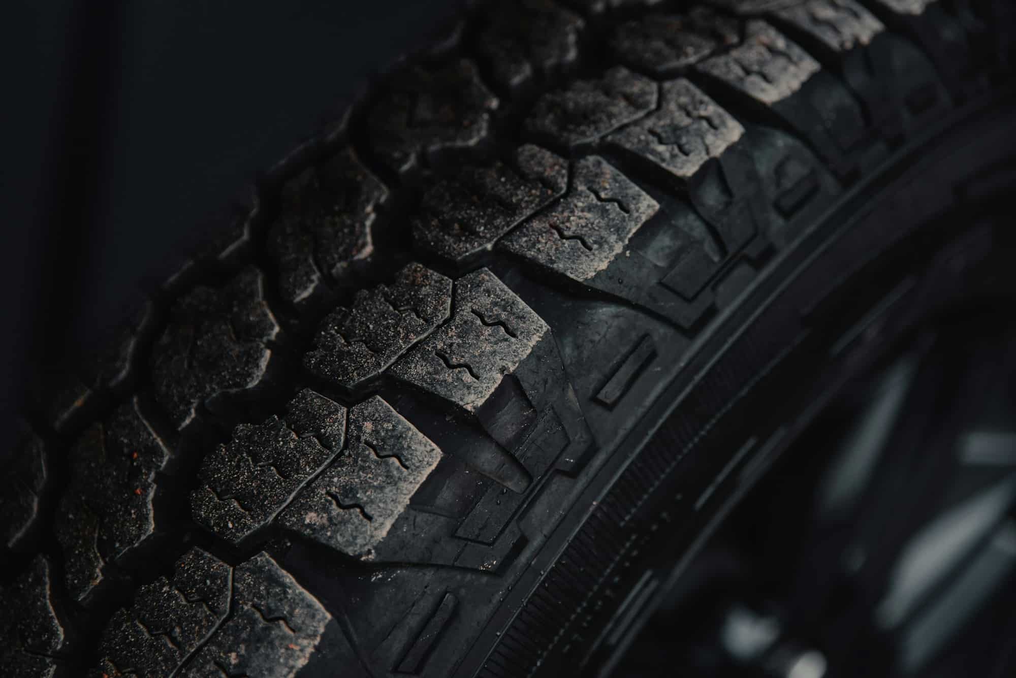 Black tire on black surface — illustrative photography