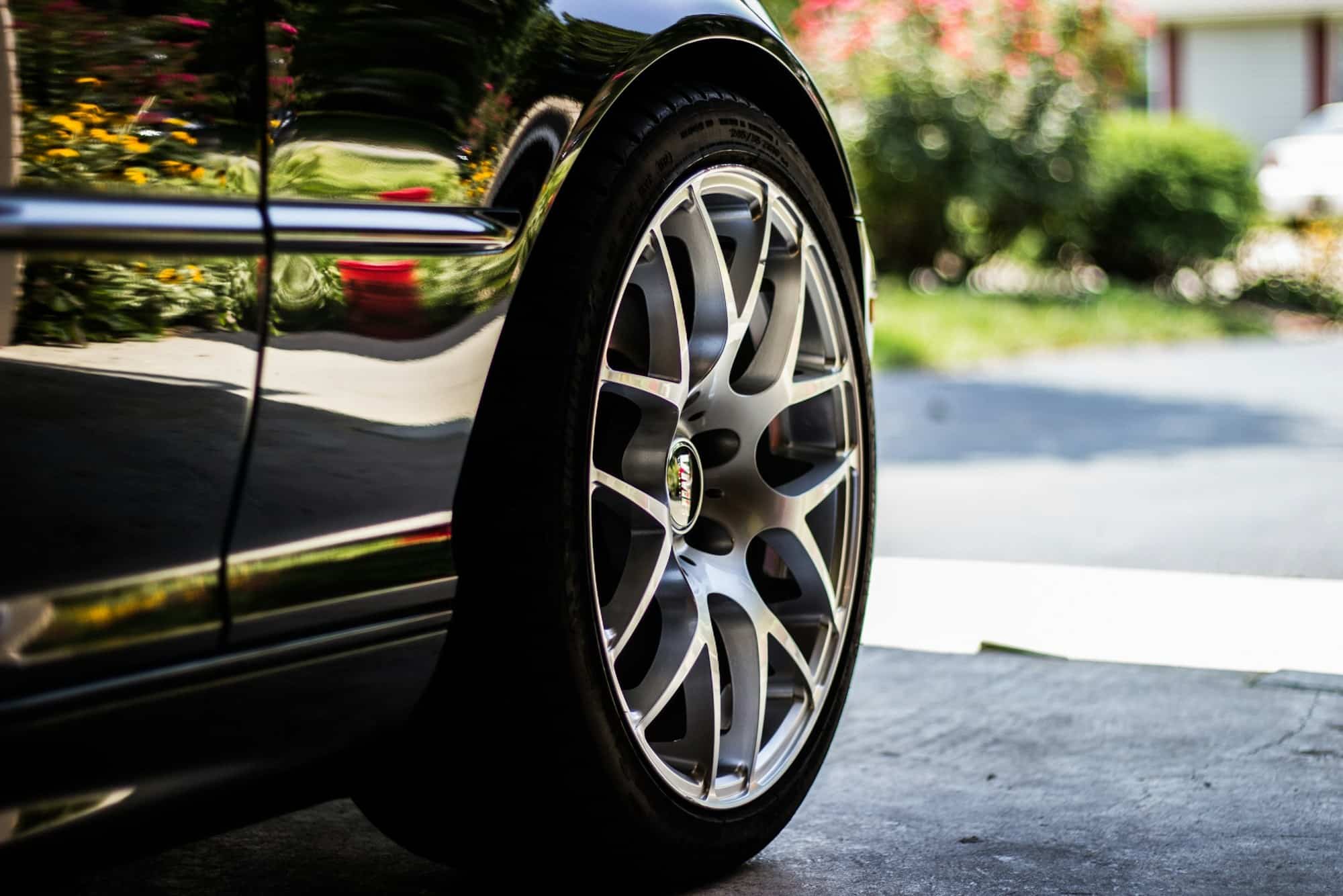Gray vehicle rim with tire — illustrative photography